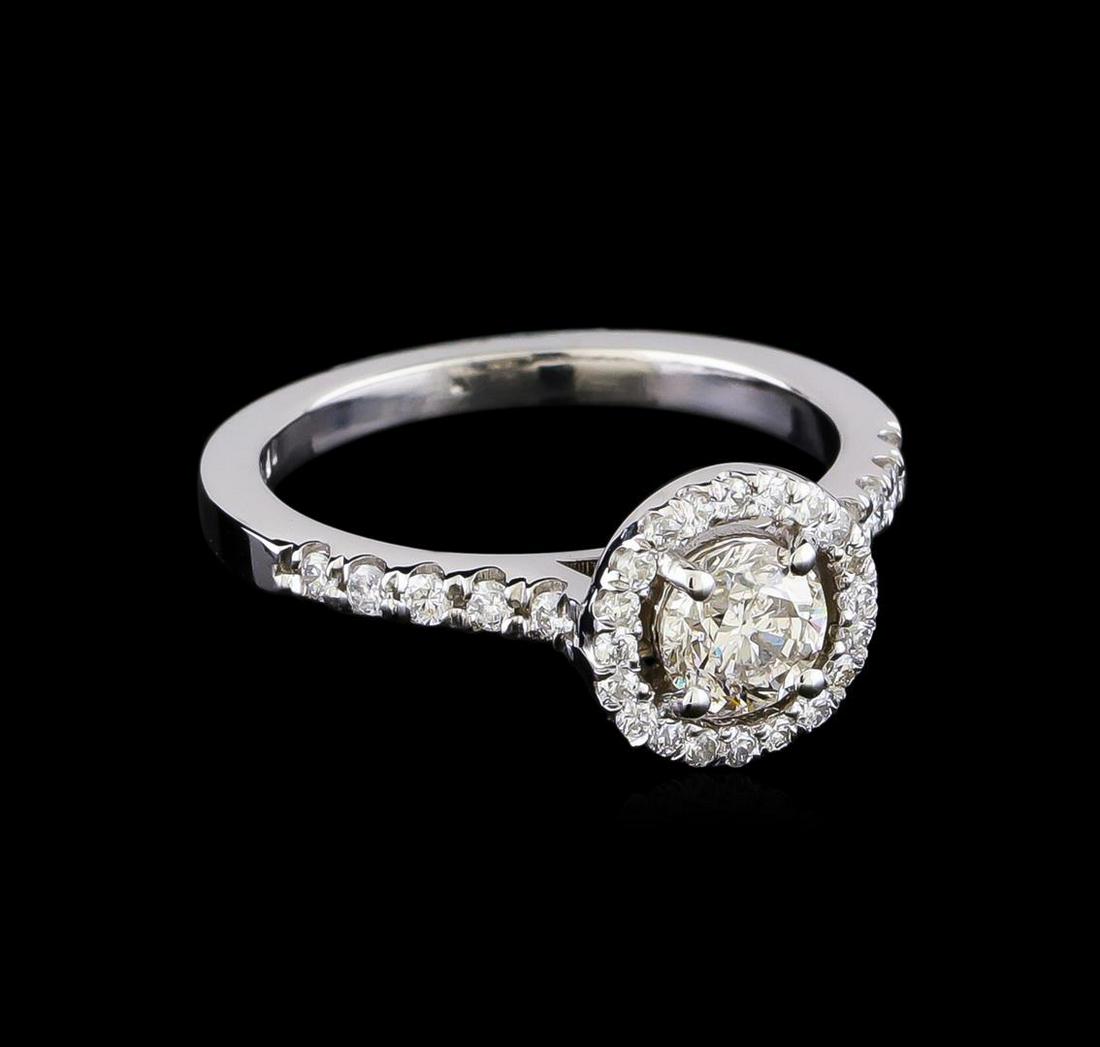 0.93 ctw Diamond Ring - 14KT White Gold: One electronically tested 14KT white gold lady's cast wedding ring with a halo with a bright polish finish. The featured lady's ring has a shank measuring 1.97 millimeters in width. Identified with ma