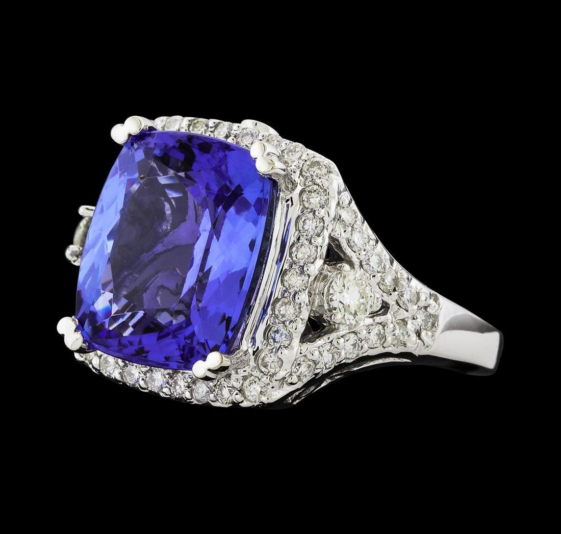 GIA Cert 8.38 ctw Tanzanite and Diamond Ring - 14KT White Gold: One electronically tested 14KT white gold lady's cast fashion ring with a cathedral shank with a basket halo with a bright polish finish. The featured lady's ring has a shank measuring 2.08 millimeter
