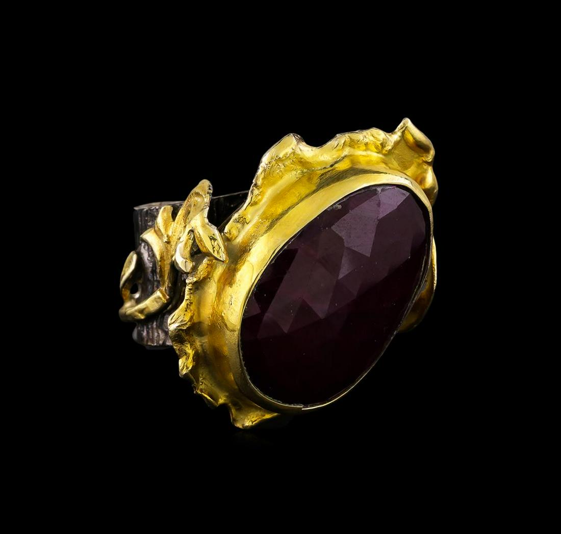 Sterling Silver Ring: One of a kind high fashion sterling silver Ring weighing 34 grams. Black Antique texture. Containing: Ruby. This sterling silver promises a lasting shine.