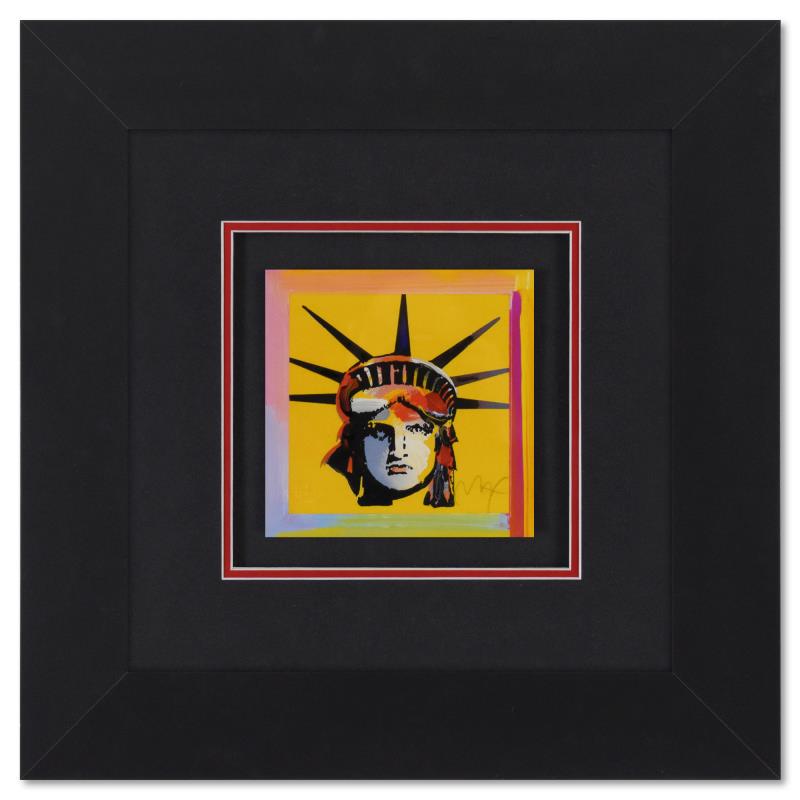 Liberty Head by Peter Max: "Liberty Head" is a limited edition lithograph on paper by Peter Max, numbered and hand signed by the artist. This piece comes framed. Includes Certificate of Authenticity from Peter Max Studios. Meas