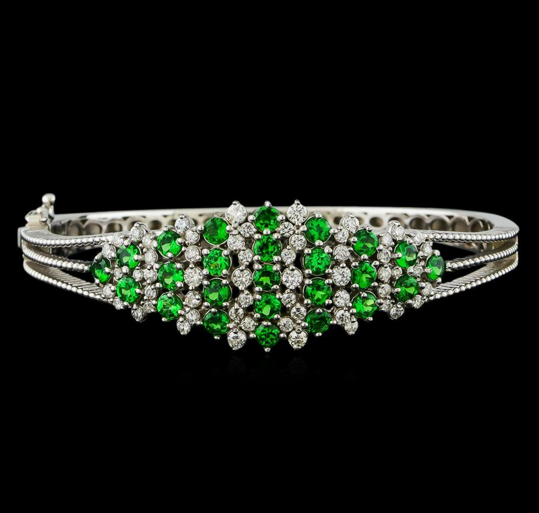 3.68 ctw Tsavorite and Diamond Bracelet - 14KT White Gold: One electronically tested 14KT white gold lady's cast fashion bangle bracelet with a tongue clasp with foldover safety with a bright polish finish. The featured lady's bracelet has a circumference of