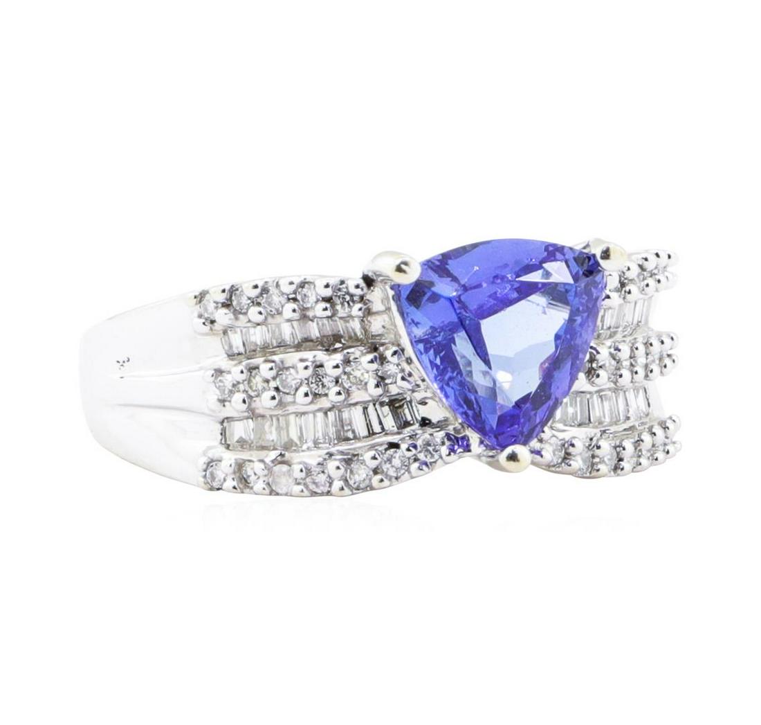 2.54 ctw Tanzanite And Diamond Wide Band - 14KT White Gold: One electronically tested 14KT white gold lady's cast fashion five row wide band with a cathedral shank with a bright polish finish. The featured lady's ring has a shank measuring 2.20 millimeters in 