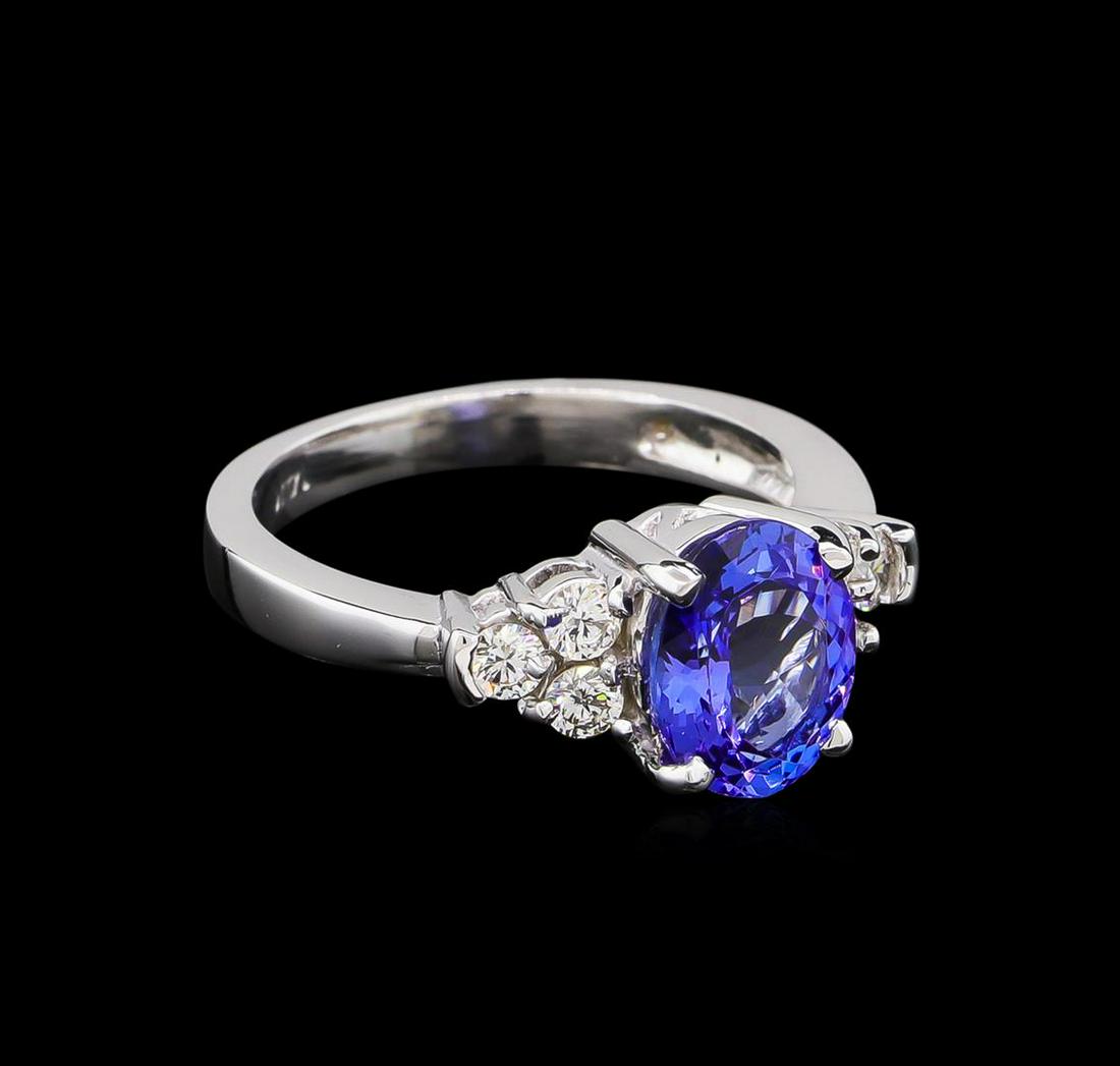 2.06 ctw Tanzanite and Diamond Ring - 14KT White Gold: One ring featuring: 14KT white gold weighing 4.38 grams containing one tanzanite with a total weight of 2.06ct and side diamonds with a total weight of 0.37ct.