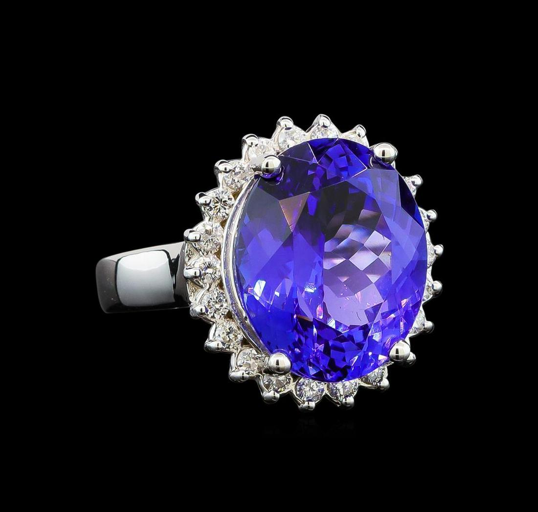 GIA Cert 10.17 ctw Tanzanite and Diamond Ring - 14KT White Gold: One electronically tested 14KT white gold lady's cast fashion ring with a basket halo with a bright polish finish. The featured lady's ring has a shank measuring 2.82 millimeters wide. Identified with