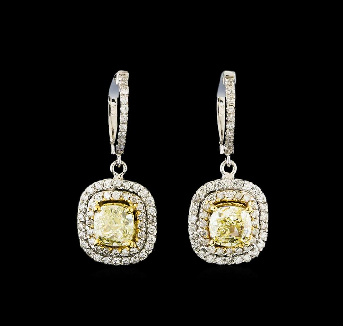 4.08 ctw Fancy Yellow Diamond Earrings - 14KT White and Yellow Gold: One pair electronically tested 14KT white and yellow gold lady's combination cast & assembled fashion earrings with hinged, snap locking posts with a double cushion halo with a bright polish finish. I