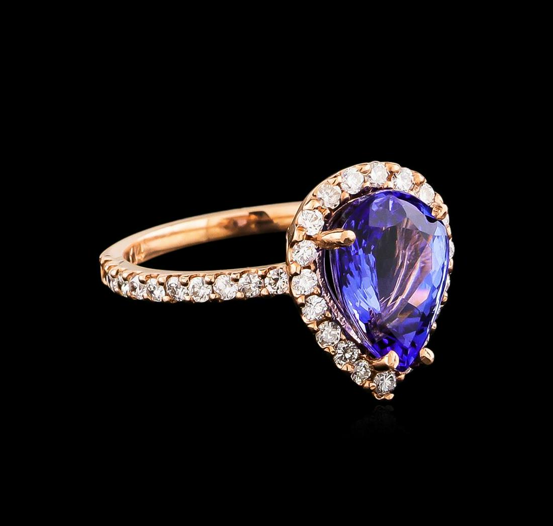 14KT Rose Gold 2.77 ctw Tanzanite and Diamond Ring: One electronically tested 14KT rose gold Ladies combination cast & assembled ring with a bright polish finish. Condition is new. Identified with markings of "14K". Containing: One prong set pear modif