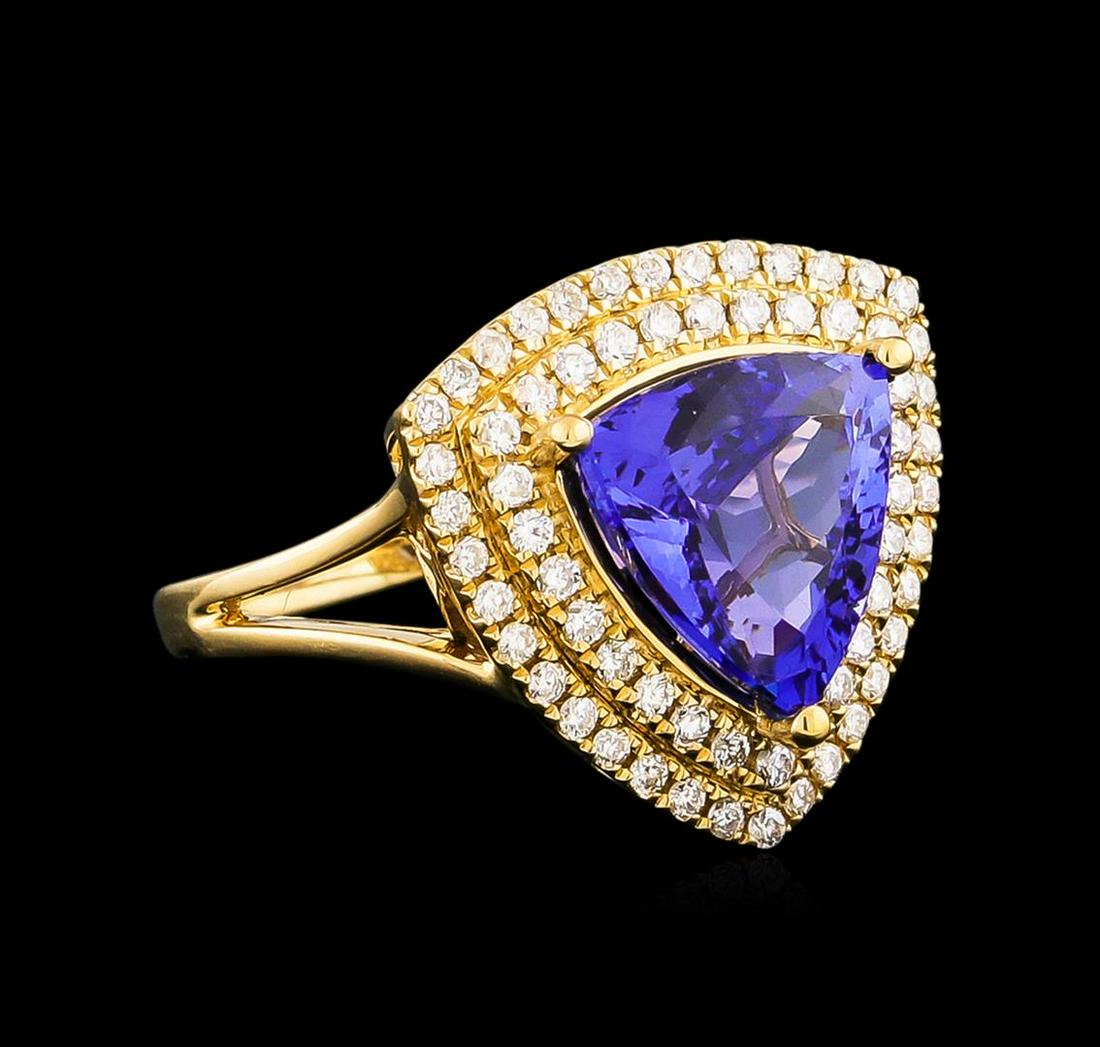 14KT Yellow Gold 4.45 ctw Tanzanite and Diamond Ring: One electronically tested 14KT yellow gold Ladies combination cast & assembled fashion ring with a bright polish finish. Condition is new. Identified with markings of "14K". Containing: One prong set 