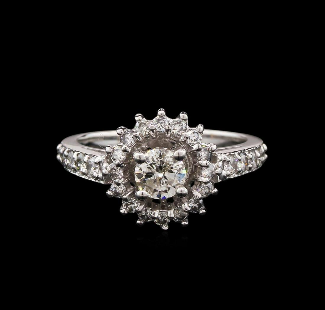 1.01 ctw Diamond Ring - 14KT White Gold: One electronically tested 14KT white gold lady's combination cast & assembled wedding ring with a basket halo with a bright polish with milgrain detailing finish. The featured lady's ring has a shank