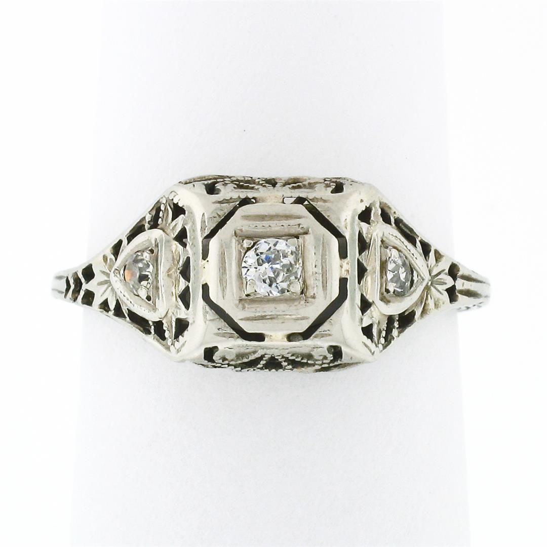 Antique Art Deco 18k Gold Old European & Single Cut Diamond Puffed Filigree Ring: An antique art deco solid 18k white gold filigree ring, with 3 old european and single cut natural diamonds (G/H - VS2/SI1 ; 0.11ctw). The ring is size 4.5, weighs a total of 1.62 grams, and measures 