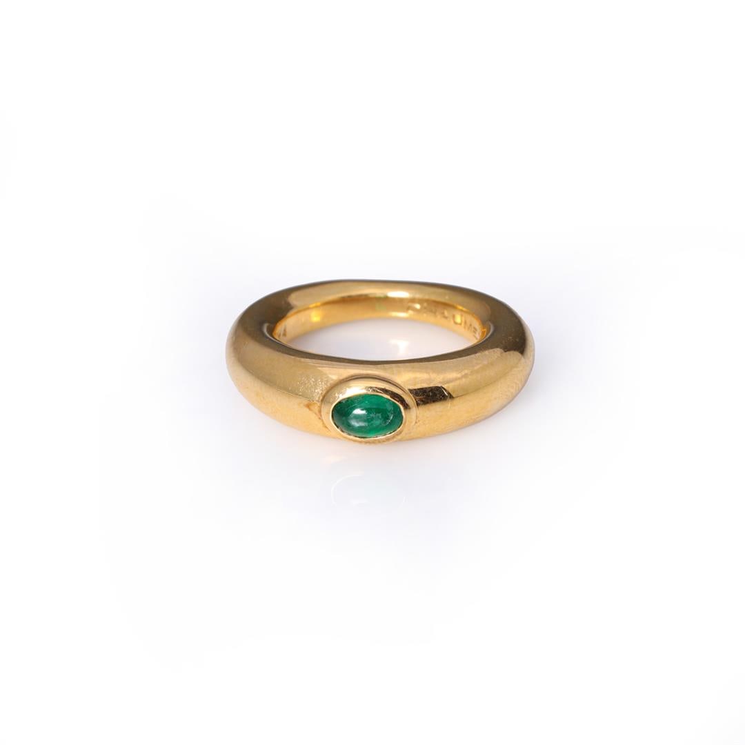 Vintage 18K Gold & Emerald Ring by Chaumet: A fine vintage 18k yellow gold ring by Chaumet, Paris; set with a oval green emerald cabochon of fine color in oval bezel, the interior of the ring marked CHAUMET PARIS 139364, with two French touch m