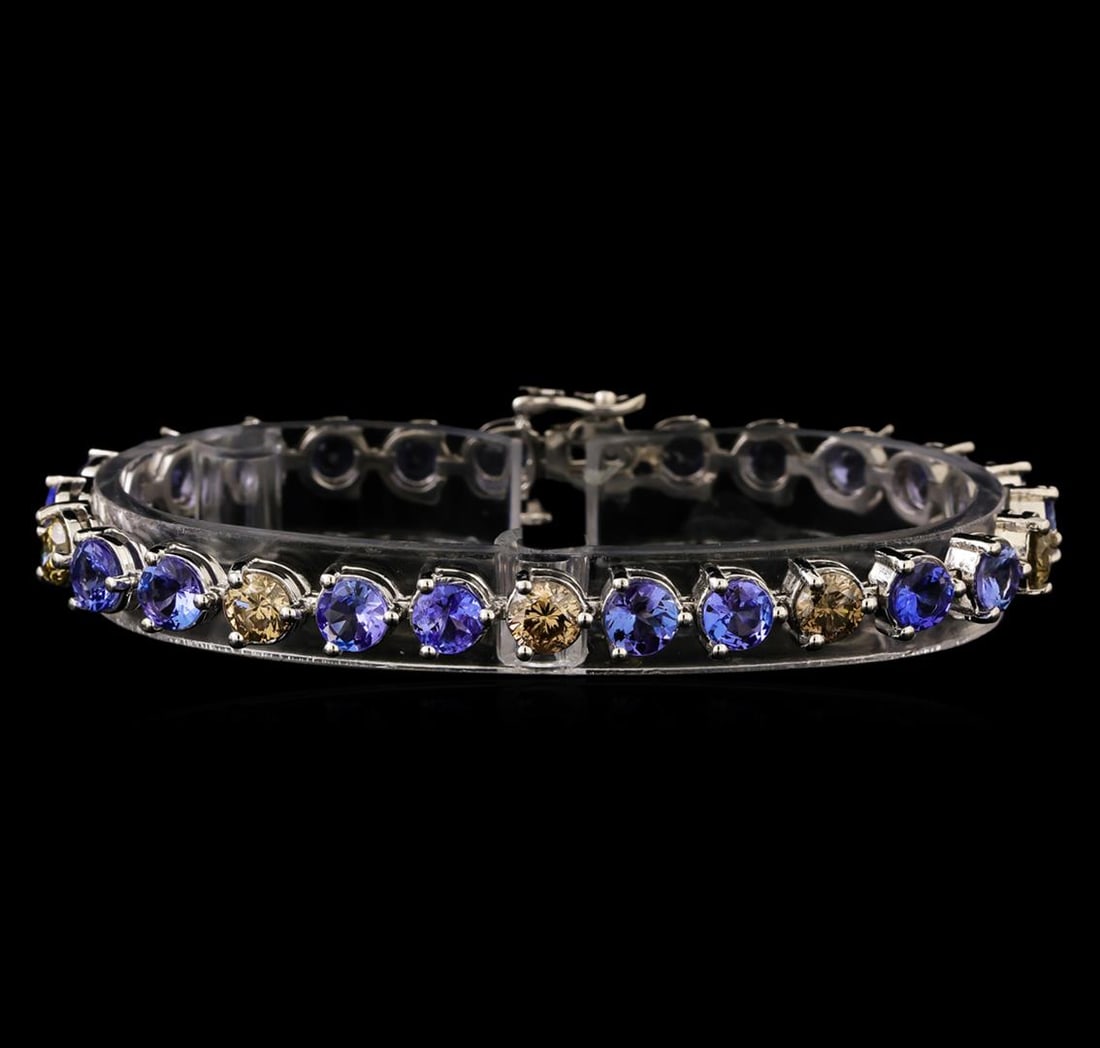 14KT White Gold 9.46 ctw Tanzanite and Diamond Bracelet: One electronically tested 14KT white gold ladies combination cast & assembled tanzanite and diamond bracelet with a hidden box clasp with safety closer with a bright polish finish. Bracelet measures 7