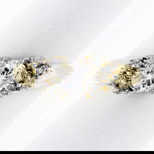 14K Yellow Gold .85 ctw Round Diamond Solitaire Engagement Ring w/ Tiered Accent: An estate solid 14k yellow and white gold tiered ring, with 1 round brilliant cut natural diamond (G - I1; 0.55ct), and 10 round brilliant cut natural diamonds (G/H- SI1; 0.30ctw). The ring is size 6.