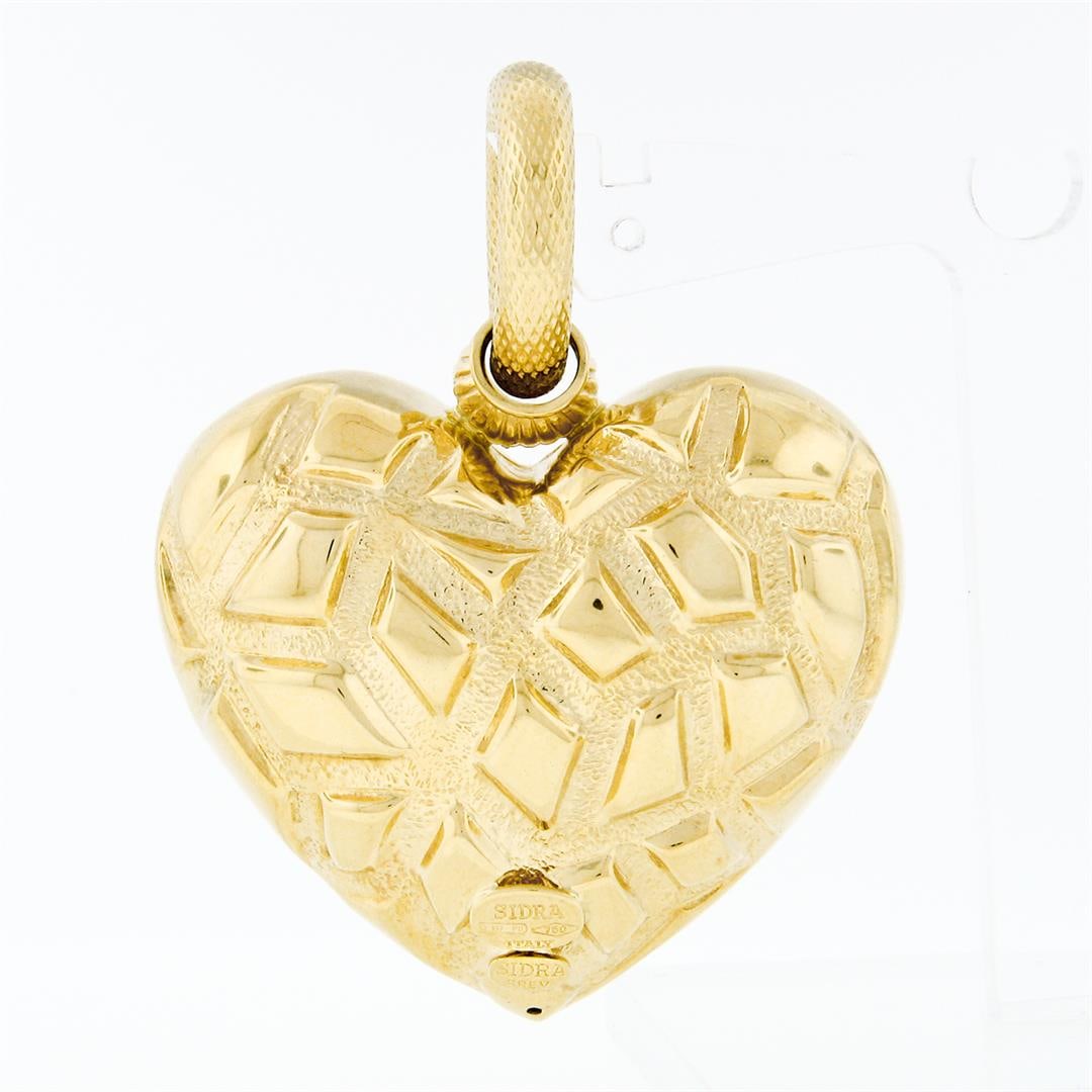 Sidra Brev Italian 18K Yellow Gold Large Puffed Textured Mosaic Heart Pendant: A Designer Sidra Brev solid 18k yellow gold mosaic heart charm pendant. The pendant weighs a total of 16.88 grams, measures 52.80x41.25mm including the bail, and the bail diameter measures 9.95mm.