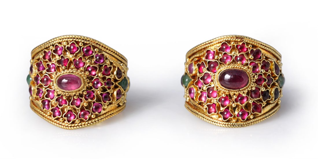 Two Antique Cambodian 22K Gold Ceremonial Thumb Rings: Two antique Cambodian 22k ceremonial thumb rings with intricate detail and cabochon stones; gross weight 25.2 g, sizes 11 1/2 and 12