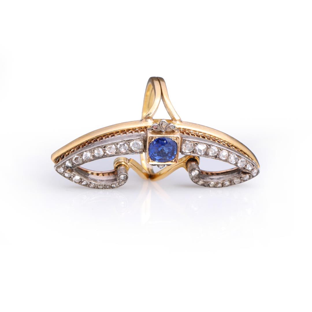 Art Deco 14k Yellow & White Gold Sapphire & Diamond Cocktail Ring: Vintage art deco cocktail ring in the form of a stylized butterfly in 18k gold, split bands on each side with central old cut blue sapphire, claw set in square frame, to each side a pair of stylized w