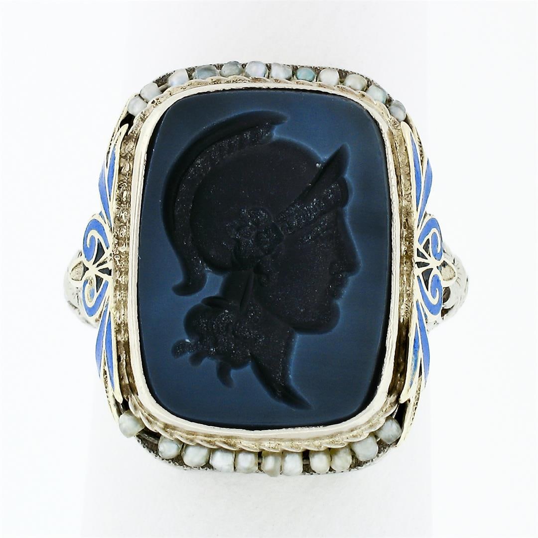 Antique 14k Gold Athena Warrior Intaglio Agate Seed Pearl & Enamel Filigree Ring: An antique solid 14k white gold intaglio cocktail ring, with blue enamel work, 1 carved rectangular cushion shape natural agate (15.35x11.37mm), with 23 round bead shape seed pearls (0.90mm ). The rin