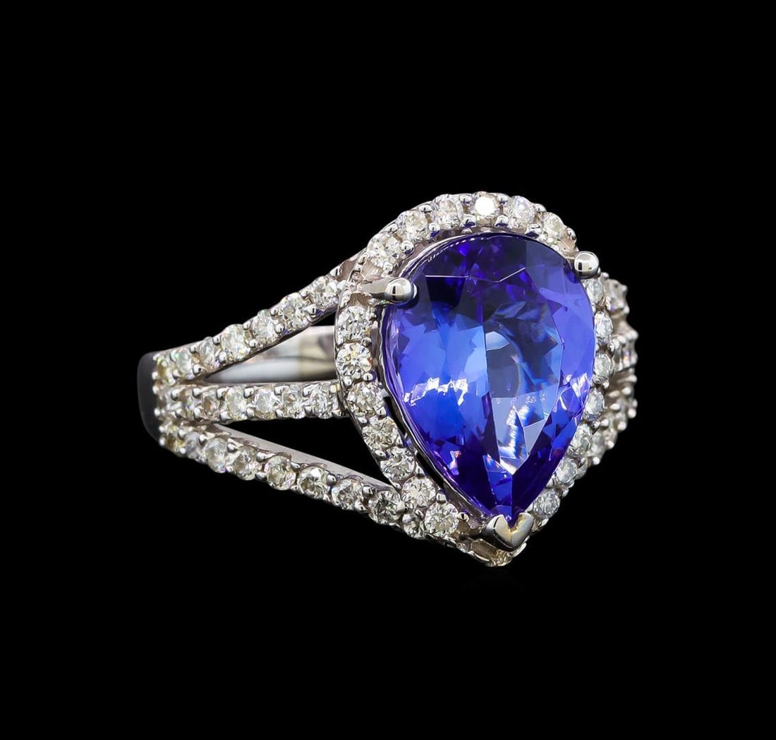 18KT White Gold 3.44 ctw Tanzanite and Diamond Ring: One electronically tested 18KT white gold ladies cast tanzanite and diamond ring with a bright polish finish. Identified with markings of "18K". Condition is new. Containing: One prong set pear modifi