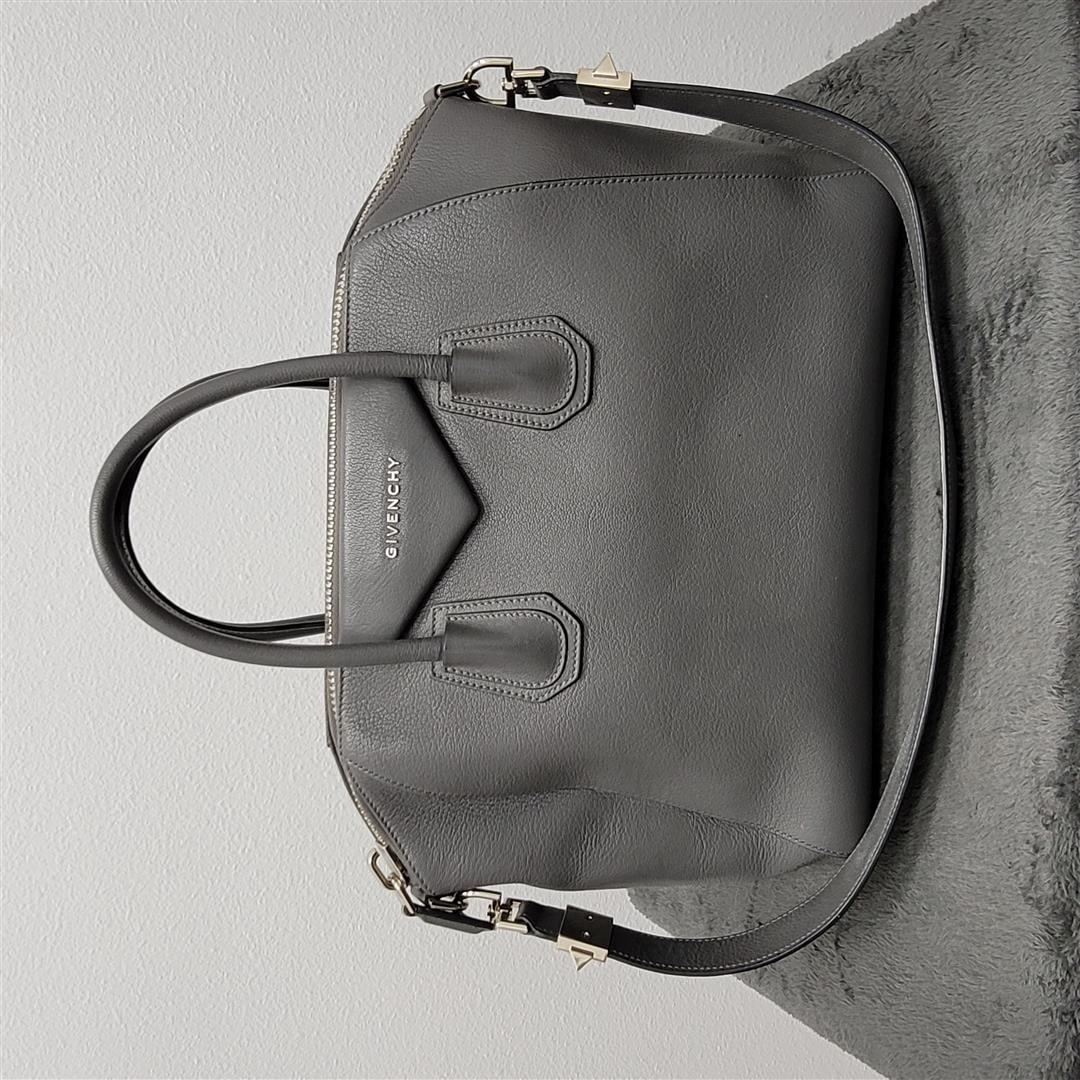 Givenchy Antigone Medium Leather Satchel in Pearl Grey: One Givenchy Antigone Medium Leather Satchel. This is an authentic GIVENCHY Sugar Goatskin Medium Antigona in Pearl Grey. This elegant model is crafted of luxuriously grained grey goatskin leather wit
