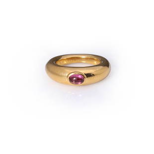 Vintage 18K Gold & Amethyst Ring by Chaumet: A fine vintage 18k yellow gold tube ring by Chaumet, Paris; set with a fine quality oval amethyst cabochon in oval bezel, the interior of the ring marked CHAUMET PARIS 153927-750, with two French touc