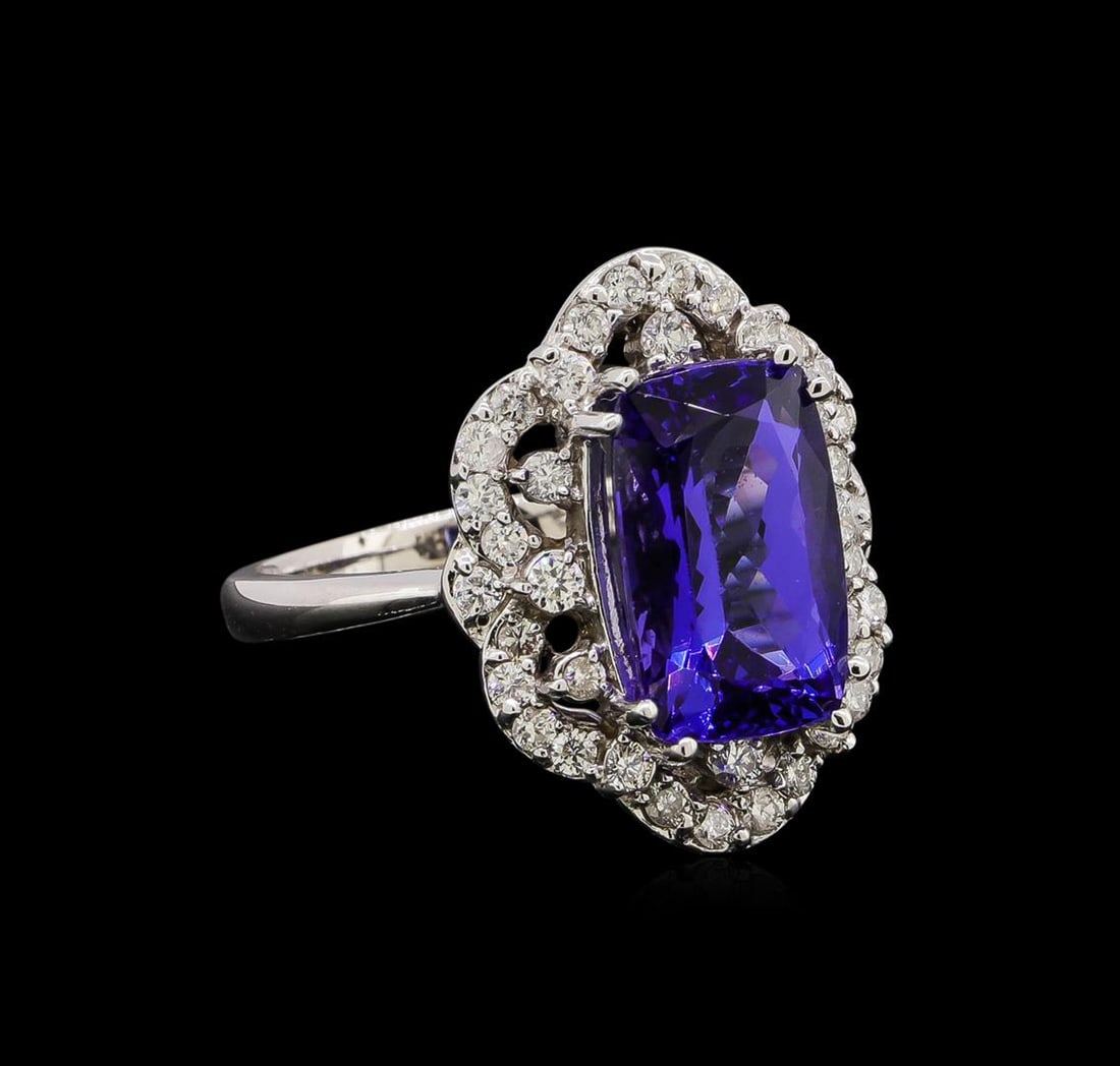 14KT White Gold 4.71 ctw Tanzanite and Diamond Ring: One electronically tested 14KT white gold ladies cast tanzanite and diamond ring with a bright polish finish. Identified with markings of "14K". Condition is new. Containing: One prong set rectangular