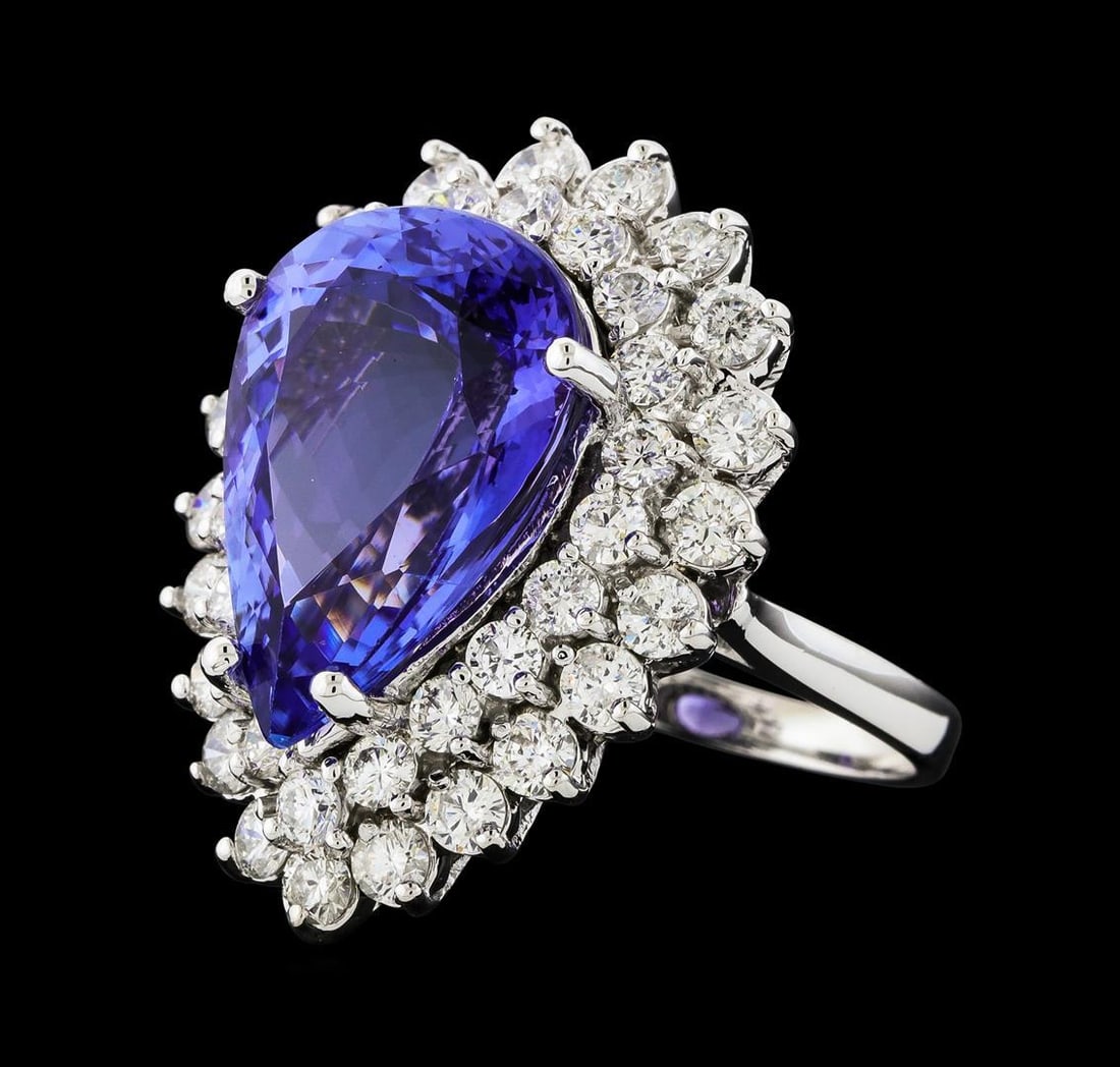 GIA Cert 12.13 ctw Tanzanite and Diamond Ring - 14KT White Gold: One electronically tested 14KT white gold lady's cast fashion ring with a double basket halo with a bright polish finish. The featured lady's ring has a shank measuring 2.23 millimeters wide. Identifi