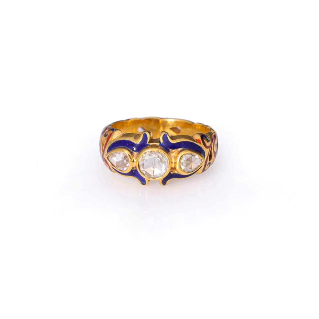Vintage 22k Gold & Enamel Diamond Ring: A vintage 22k yellow gold and diamond ring; bezel set with a larger central rose cut diamond measuring approximately .25 carats, flanked to each side with two pear shaped diamonds, surrounded on top w