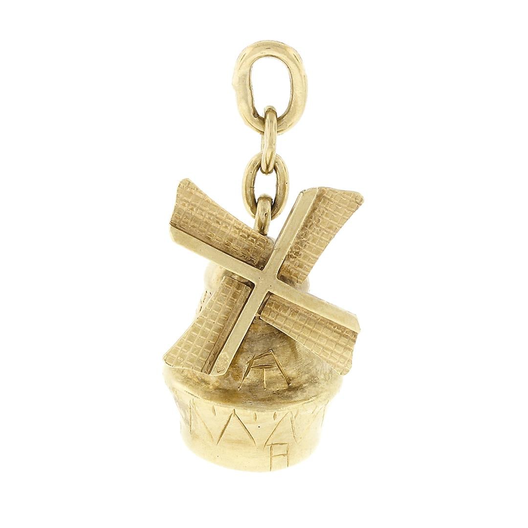 Vintage 14k Gold Collectible Windmill Structure w/ Spinning Fan Charm Pendant: A vintage solid 14k yellow gold windmill structure with functional spinning fan charm pendant. The pendant weighs a total of 3.5 grams, measures 27.9x12.9mm including the bail, and the inside of the b
