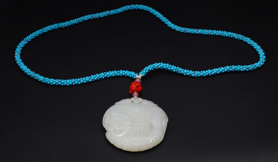 Antique Chinese Jade Toggle & Turquoise Necklace: Antique Chinese, Qing Dynasty mutton fat carved Da Xing jade pei of elephant design, mounted on later turquoise bead necklace with pink tourmaline beads and glass Buddha head accents; gross weight 69.