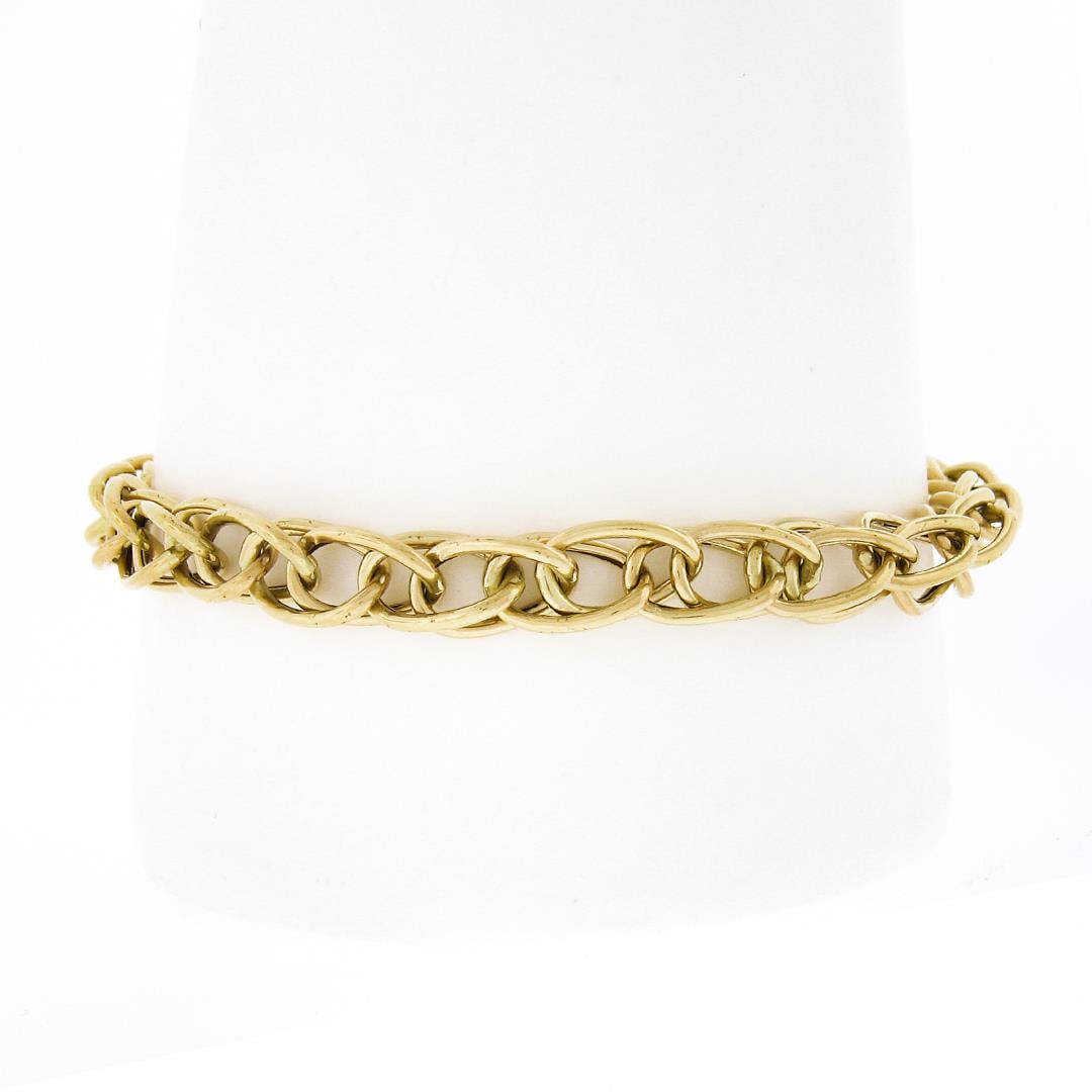 Vintage 14k Gold 7.25" Polished Interlocking Curb Link Stackable Chain Bracelet: A vintage solid 14k yellow gold curb link bracelet. It weighs a total of 8.75 grams, measures 7.1mm wide, and measures 7.25 inches in length.