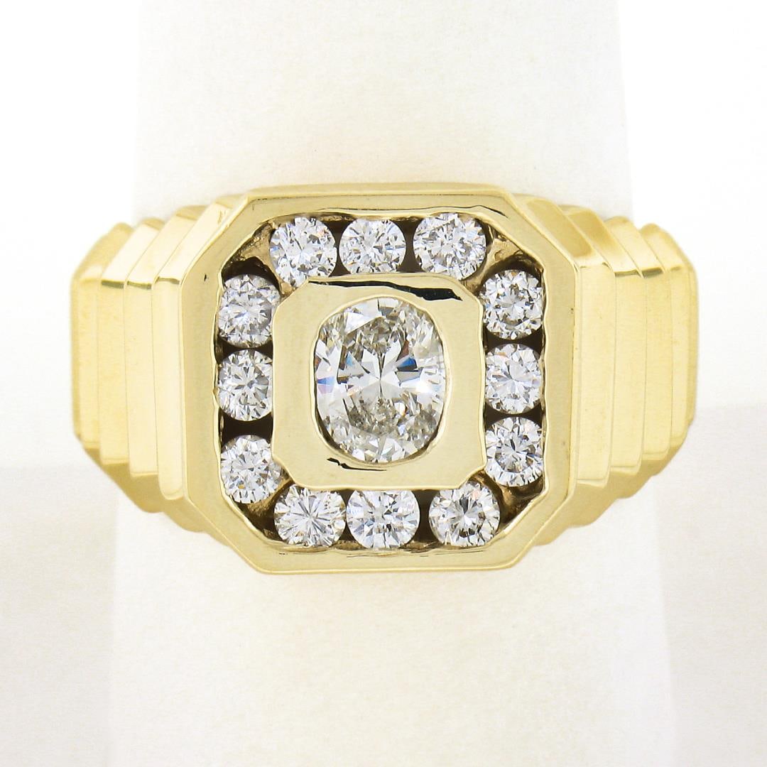 Mens 14k Yellow Gold 1.13 ctw Bezel Oval & Square Halo Diamond Ribbed Shank Ring: A solid 14k yellow gold mens ring, with 1 oval brilliant cut natrual diamond (J - I1 ; 5.73x4.73mm - 0.53ct), and 12 round brilliant cut natural diamonds (G/H - SI1/SI2 ; 0.60ctw). The ring is size 9.