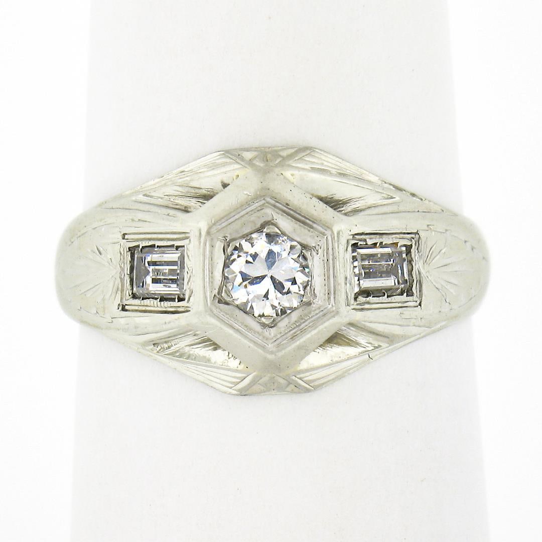 Antique Art Deco 18k Gold Old European w/ Baguette Diamond Hand Engraved Ring: An antique solid 18k white gold ring, with 0.37ctw 1 old european cut natural diamond (G/H - VS2/SI1), and 2 baguette cut natural diamonds (G/H - VS2/SI1). The ring is size 6.5, weighs a total of 3.37