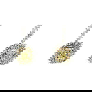 16.70 ct. EGL USA Fancy Light Yellow Diamond Dangle Earrings - 18KT White and Ye: These dangle earrings feature 11.20ct of fancy light yellow radiant cut diamonds with SI-1 clarity, surrounded by 5.50ct of round brilliant diamonds for extra sparkle. She will look stunning in these!
