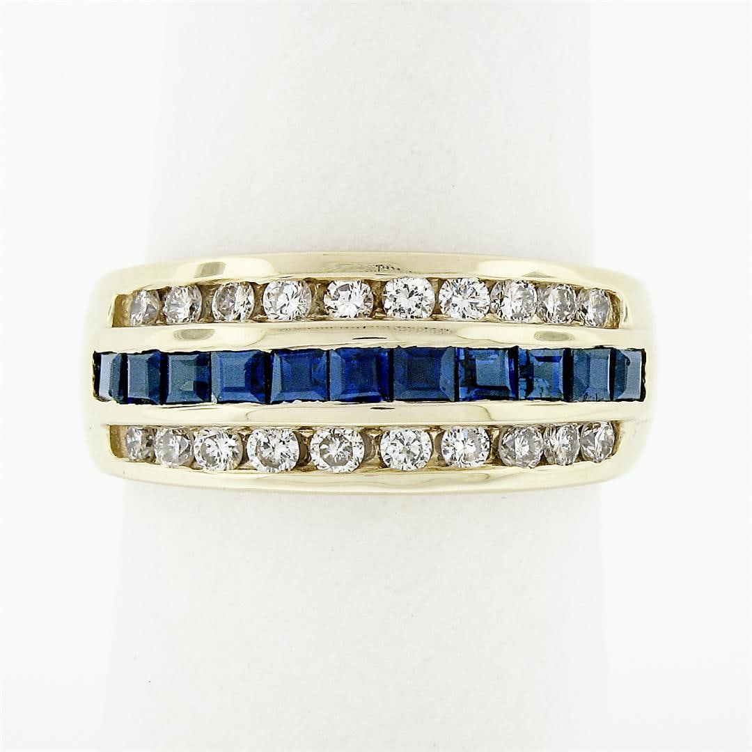 14K Yellow Gold 1.37 ctw Blue Square Step Channel Set Sapphire & Diamond Band Ri: An estate solid 14k yellow gold wide band ring, with 11 square step cut natural sapphires (0.77ctw ), and 20 round brilliant cut natural diamonds (G/H - VS1/VS2 ; 0.60ctw). The ring is size 7.5, weigh