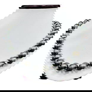 Pearl and Diamond Necklace - 14KT White Gold: One graduated single strand pearl necklace 18.5" princess length, knotted with a tongue clasp & foldover safety containing 35 Tahitian pearls, 13.8mm to 11.1mm in size. The pearls are black in color,