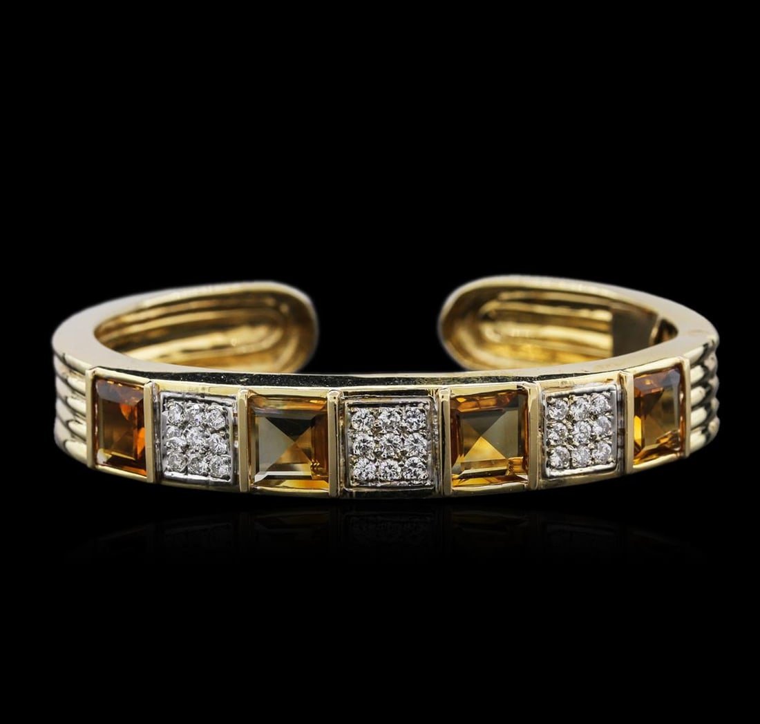 14KT Yellow Gold 10.16 ctw Citrine and Diamond Bracelet: One electronically tested 14KT yellow gold ladies cast citrine and diamond cuff bracelet with a bright polish finish. Identified with markings of "14K". Condition is new. Containing: Four bezel set em