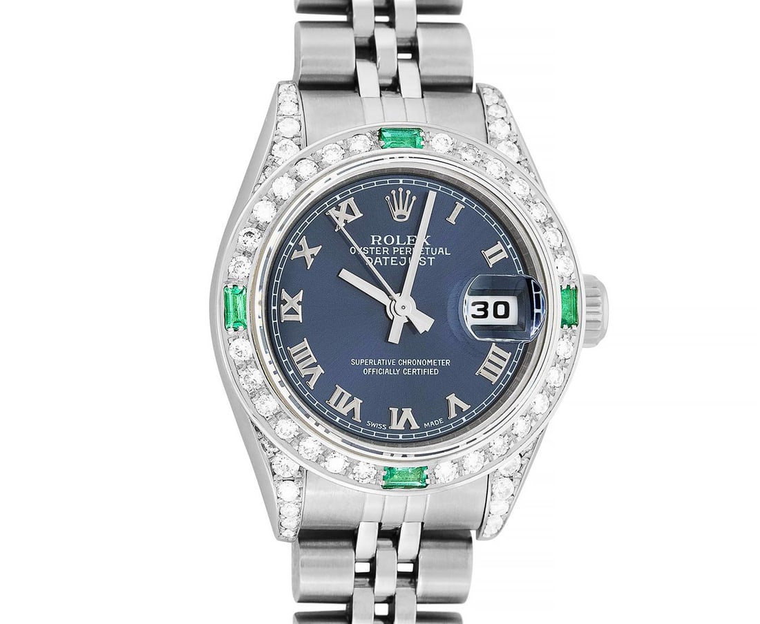 Rolex Ladies Quickset Stainless Steel Blue Roman 18K White Gold Diamond & Emeral: One Ladies Pre Owned Quickset Stainless Steel Rolex Datejust Polished Bright with Satin Finish, Serviced & Electronically Tested, Rolex Stainless Steel Case: 26mm, Custom Diamond Lugs: Added Diamonds
