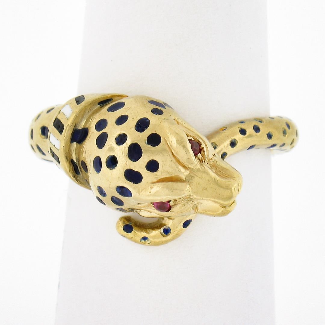 Vintage 18k Gold Ruby Eyes Detailed Blue Enamel Dot Spotted Leopard Serpent Ring: A vintage solid 18k yellow gold leopard ring with enamel work & 2 round brilliant cut natural rubies (0.03ctw). The ring is size 6.5, weighs a total of 12.37 grams, and measures 11.60mm wide.