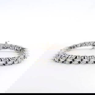11.07 ctw Diamond Tennis Bracelet - 14KT White Gold: For those seeking a distinctive accessory, this 14KT white gold tennis bracelet offers understated elegance with a twist. Featuring 39 prong-set round brilliant diamonds in a warm fancy yellowish brow