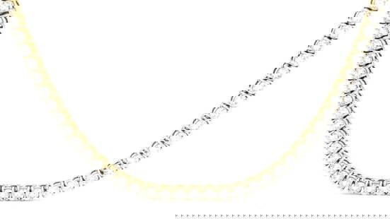 14KT Yellow Gold 29.50 ctw Diamond Eternity Necklace: This exquisite 14KT yellow gold eternity necklace features a timeless design with a secure tongue clasp and fold-under safety. The piece showcases 158 round brilliant cut diamonds, totaling an