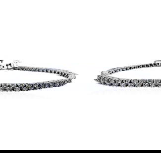 3.77 ctw Diamond Tennis Bracelet - 14KT White Gold: One electronicaly tested 14KT white gold lady's combination cast & assembled fashion straight line tennis bracelet with a tongue clasp with fold-under safety with a basket motif with a bright polish f