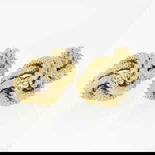Tiffany & Co. 14k Gold .24 ctw Bezel Diamond Textured Infinity Love Knot Cufflin: A solid 14k yellow gold love knot cufflinks by Tiffany & co., with 2 round brilliant cut natural diamonds (E/F - VVS2/VS1 ; 0.24ctw). These cuff links have a bar design with a clearance of 9.4mm, weig