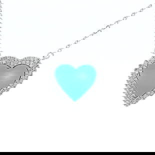 14kt WG Turquiose and Dia Heart Pendant: This enchanting 14kt white gold necklace features a heart-shaped turquoise pendant, embraced by a halo of 72 prong-set round brilliant-cut diamonds totaling 0.15ct. Each diamond is graded G-H color, V