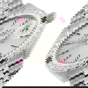 Rolex Ladies Stainless Steel Silver Index Diamond And Ruby Date Watch With Rolex: One Rolex Ladies Pre Owned Stainless Steel Date Wristwatch Polished Bright with Satin Finish, Serviced & Electronically Tested, Stainless Steel Case: 26mm, Stainless Steel Crown, Custom Bezel: New 18K
