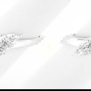 Classic 14K White Gold 0.35 ctw Illusion Set Diamond Solitaire Engagement Ring: A solid 14k white gold classic engagement ring, with 1 round brilliant cut natural diamond (G - I1 ; 0.35ct). The ring is size 7.0, weighs a total of 3.91 grams, and measures 6.95mm wide.