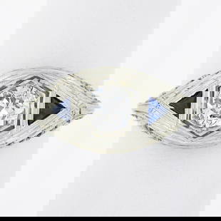 Antique Art Deco 18k Gold Old European Diamond w/ Sapphire Floral Filigree Ring: An antique solid 18k white gold ring, with 1 old European cut natural diamond (G - VS2 ; 0.50ct), and 2 trillion cut synthetic sapphire (3.2x3.2mm each). The ring is size 6.0, weighs a total of 2.90 g
