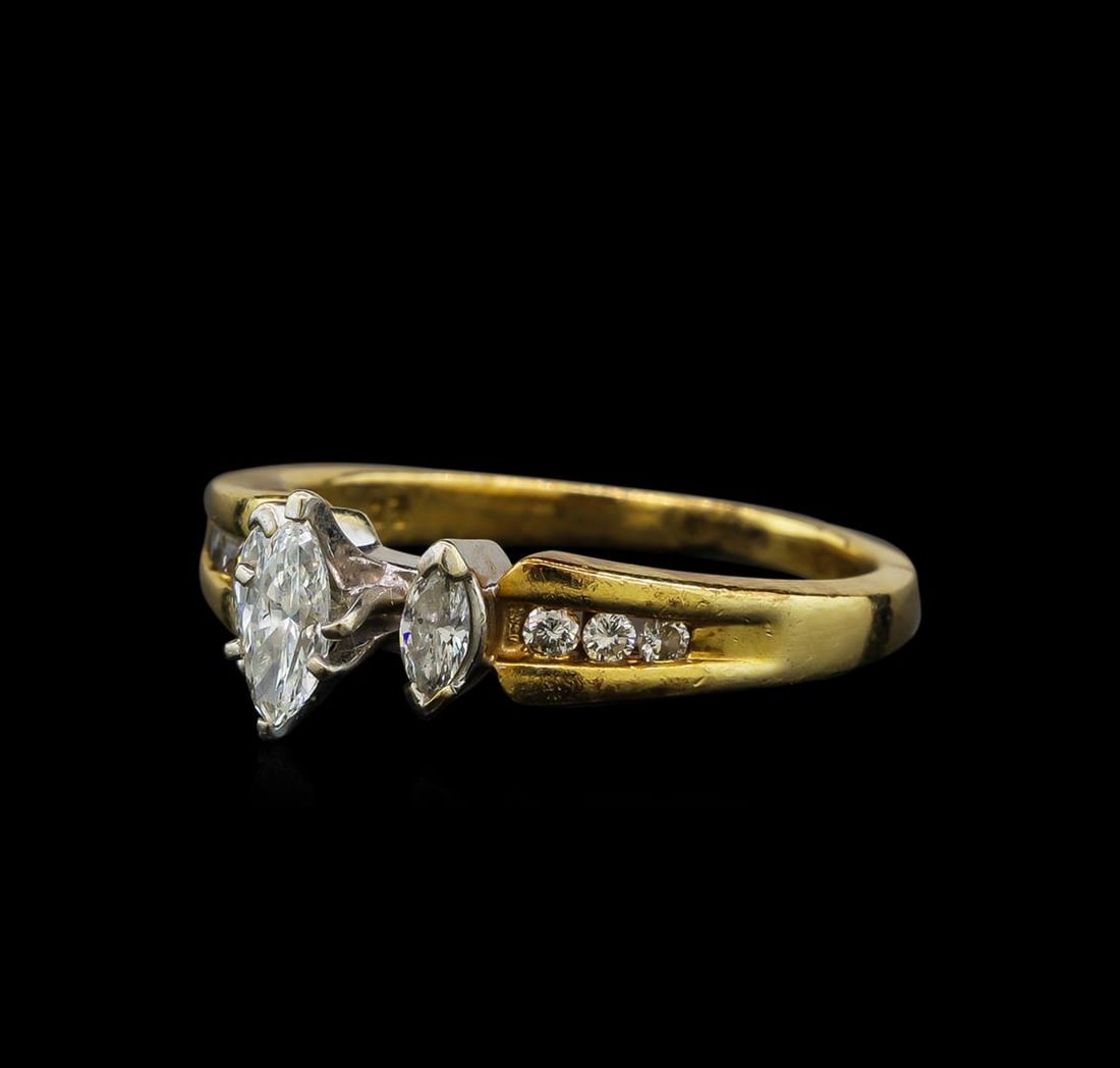 0.53 ctw Diamond Ring - 14KT Yellow and White Gold: One electronically tested 14KT yellow and white gold ladies cast & assembled diamond unity ring with a bright polish finish. The ring features a cathedral set marquise diamond accented by a single mar