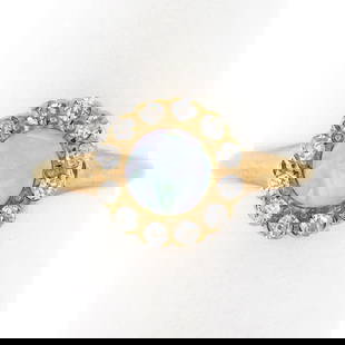 Antique Victorian 14K Gold Round Opal Solitaire Diamond Halo Petite Cluster Ring: An antique solid 14k yellow gold ring, with 1 round cabochon cut natural opal (5.2mm), surrounded with a halo of 12 old mine and old single cut natural diamonds (G/H - VS2/SI1 ; 0.24ctw). The ring is