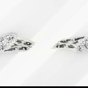Parade 18k White Gold Bezel Set .87 ctw Diamond Solitaire Milgrain Open Work Rin: An estate soldi 18k white gold open work engagement ring by Parade, featuring 1 round brilliant cut natural dimaond (G - VS1 ; 0.65ct), accented with 18 round brilliant cut natural diamonds (G/H - VS1
