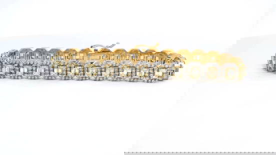 18KT Yellow Gold 8.91 ctw Emerald Cut & Diamond Tennis Bracelet: A luxurious 18KT yellow gold tennis bracelet adorned with 26 fancy light yellow emerald cut diamonds weighing 5.52 carats and 364 round brilliant cut diamonds weighing 3.39 carats, totaling 8.91 carat
