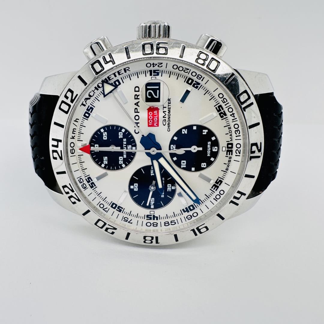 Chopard Mille Miglia Chronograph: This Chopard Mille Miglia Chronograph is a racing-inspired timepiece crafted in stainless steel. It features a silver dial with contrasting black subdials, tachymeter scale, and date display at 3 o'cl